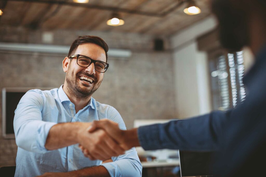 2 men shaking hands