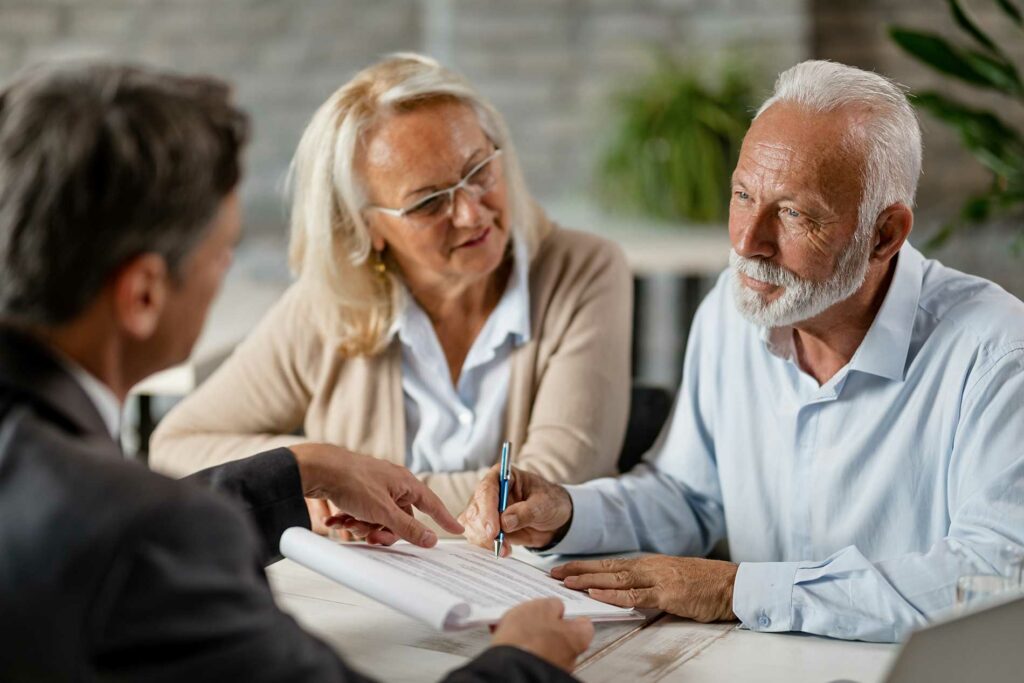 elderly couple discussing wills and estates